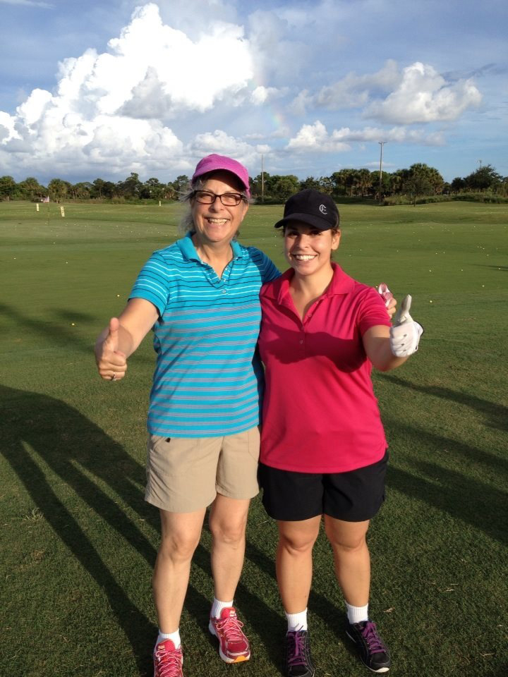 Lady golfers giving and enthusiastic thumbs up.