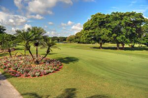 Well-manicured practice green and garden.