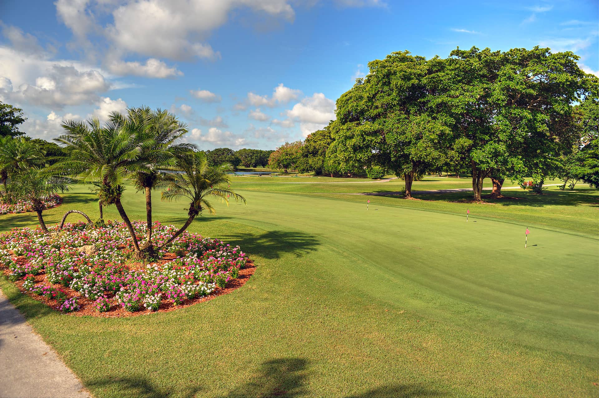 Well-manicured practice green and garden.